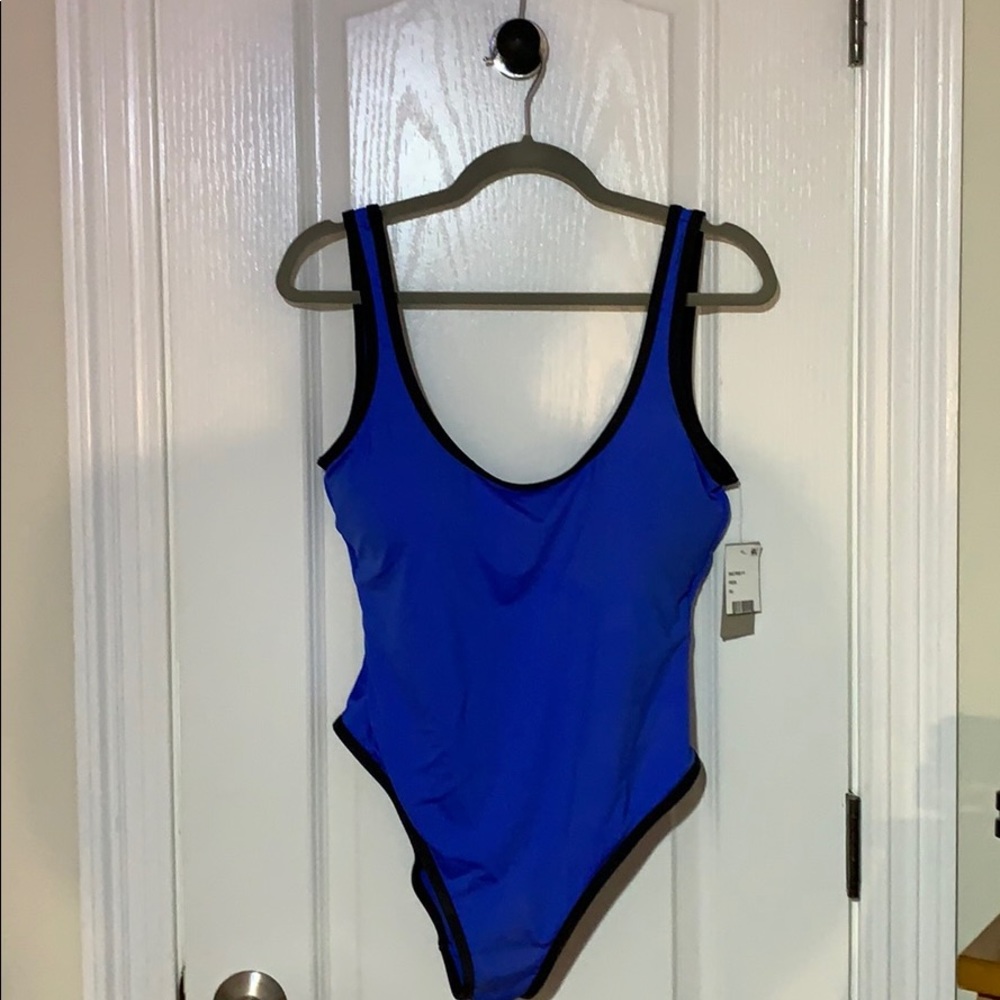 Reaction by Kenneth Cole swim tank.